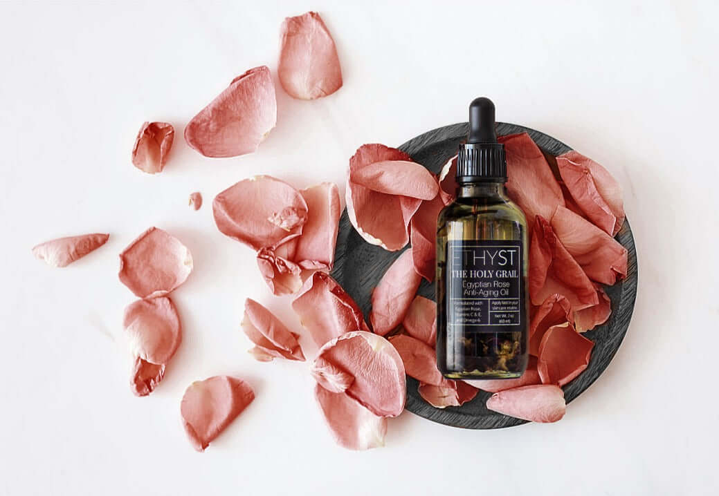 ETHYST® The Holy Grail™ Egyptian Rose Infused Anti-Aging Facial Oil contains Vitamin E that helps aid in acne scarring, hyperpigmentation, and prevents aging and wrinkles. Found at Champagne Apothecary in Westfield, Massachusetts on School Street. It is an enchanting small town shop specializing in professional skincare and self-care gifts.